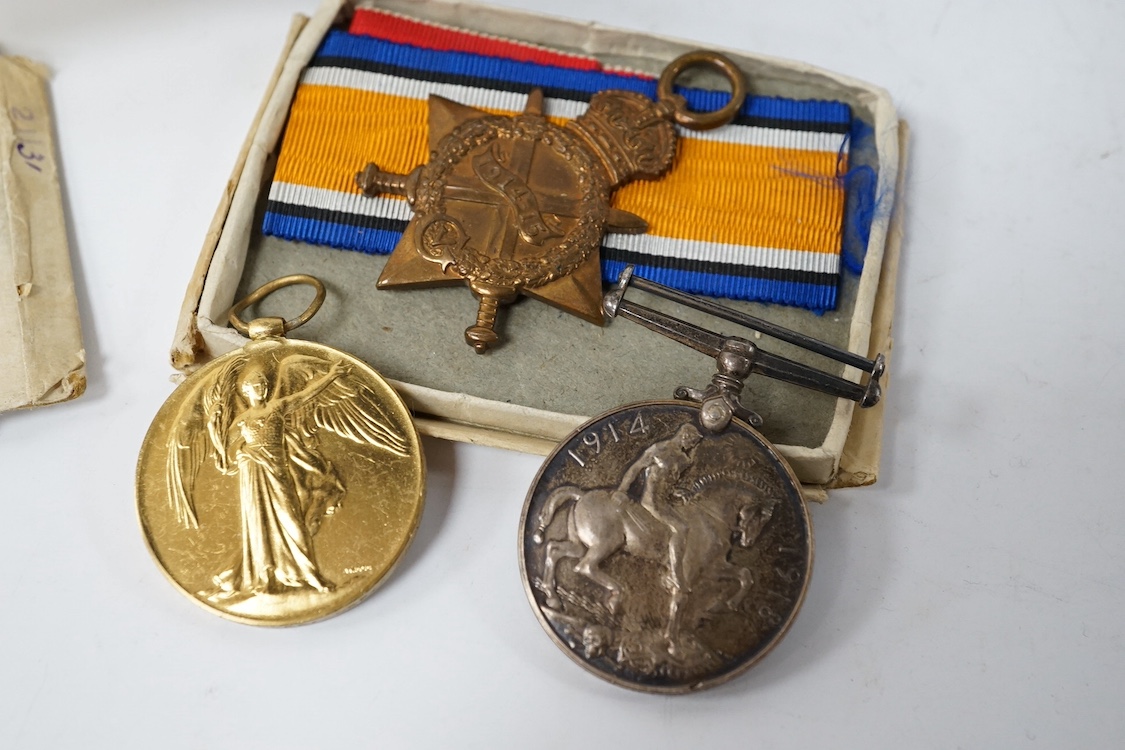 A posthumous First World War medal trio awarded to PTE. R. Holmes Oxf. & Bucks. L.I., together with the issuing letter, the remains of the original card box and a Princess Mary Christmas tin. Condition - fair.